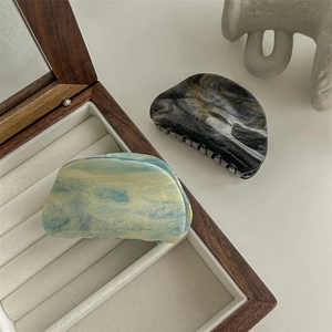 Elegant gradient marble hair claw clips in blue and black colors for stylish updos