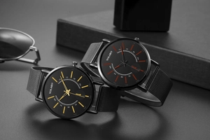 Detail view of Yolako quartz watches with mesh straps and minimalist black dial and sunglasses