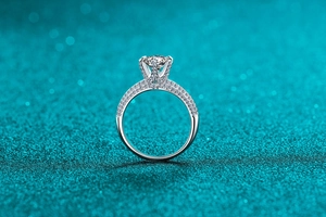 Macro shot of S925 silver ring featuring round-cut moissanite and pave-set band