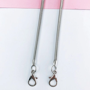 Detail of silver snake bone chains with lobster clasps for crossbody phone or bag straps
