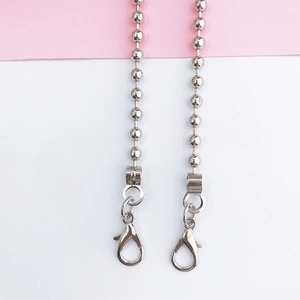 Detail showing polished silver bead chain strap with large lobster clasp for phone cases