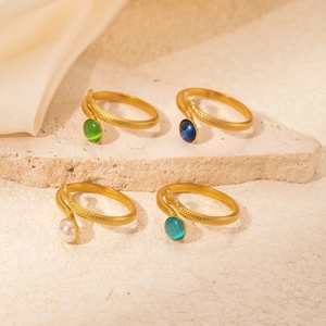 Snake-inspired gold titanium steel rings with colorful opal and pearl inlay settings