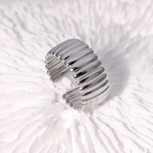 Minimalist wide ribbed stainless steel open ring with a polished silver finish for women
