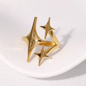 Minimalist gold star stainless steel open ring with three staggered star motifs for women