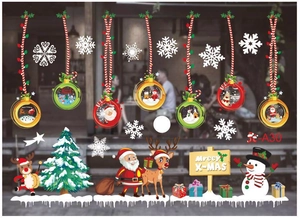 Detail of Christmas window stickers featuring colorful ornaments, Santa, and reindeer