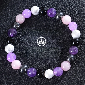 Detail of 8mm natural stone beads including amethyst and rose quartz for yoga