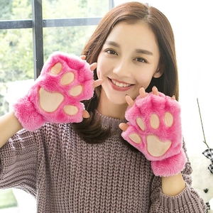 Close-up of pink plush cat paw fingerless gloves showing soft faux fur and palm detail