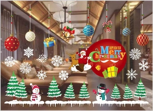 Detailed view of colorful Christmas window clings with snowman and snowflake patterns