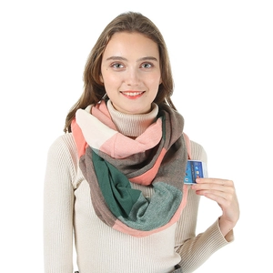 Detail of multi-color cashmere scarf featuring a hidden zipper pocket for smartphones