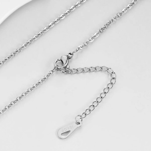 Detail of silver necklace clasp with lobster hook, extension chain and 18KGP tag