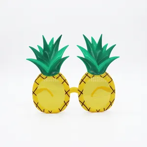 Funny yellow pineapple shaped party sunglasses with green leaves for tropical summer events