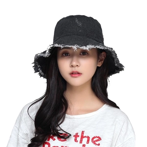 Classic black denim bucket hat with frayed edges for men and women shown on model