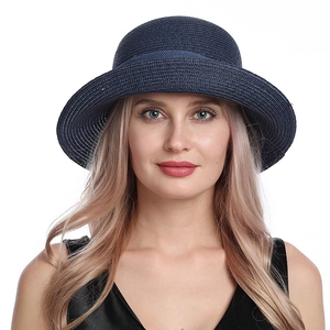 Women's navy blue straw sun hat with rolled edge and bow for stylish summer UV protection
