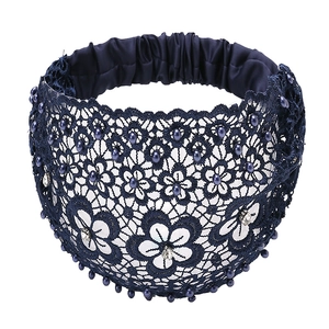 Detailed view of dark blue lace headband with elegant beads and rhinestone accents
