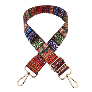 Detail of bohemian rainbow replacement bag strap with golden metal swivel hooks