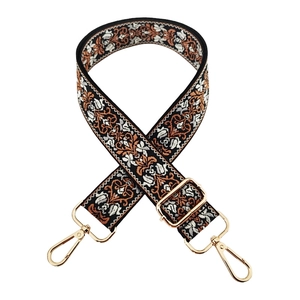 Detail of 3.8cm ethnic floral jacquard bag strap with elegant gold metal clips