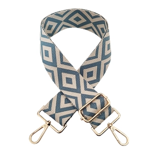 Detail of blue and white diamond pattern jacquard strap with gold lobster clasps