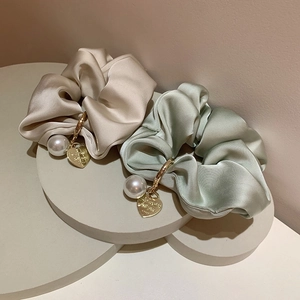 Elegant silk hair scrunchies in beige and light green with pearl and gold heart charms