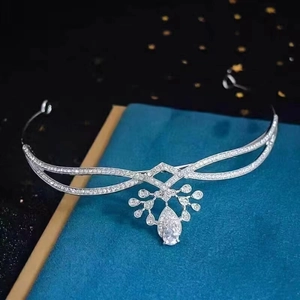 Elegant silver bridal crown with teardrop pendant and crystal stones on black background
