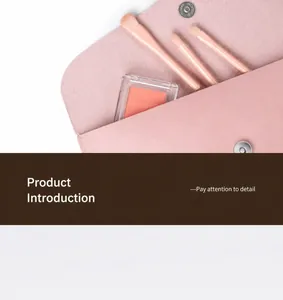 Pink matte leather envelope makeup bag with magnetic closure and soft makeup brush