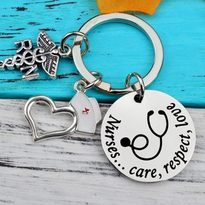Nurse appreciation stainless steel keychain with RN caduceus and enamel nurse cap charm