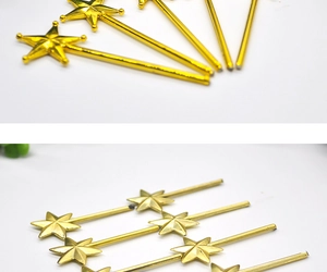 Detail of bulk golden star magic wands for DIY Christmas party decorations and crafts