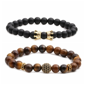 Matte black stone and tiger eye bead bracelet set with golden crown and zircon charm