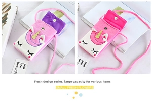 Detailed view of pink plush unicorn crossbody bag showing magnetic buckle and inner lining