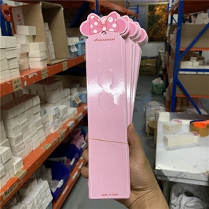 Pink cardboard display cards for long hair clips with polka dot bow decoration