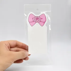 Pink floral paper display cards for hair clips in clear self-adhesive OPP packaging