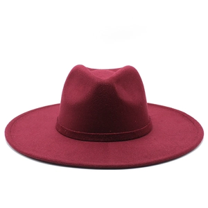 Elegant wine red wool felt fedora hat with wide brim and matching decorative ribbon