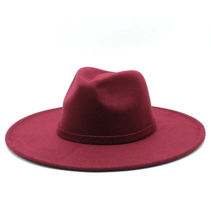 Detailed texture of burgundy wool felt wide brim fedora hat with indented crown