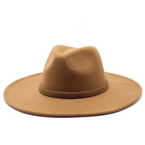 Detail of caramel brown wool fedora hat featuring a stylish wide brim and classic teardrop top