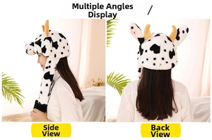 Detail view of plush cow patterned winter hat with ears and horns from side and back
