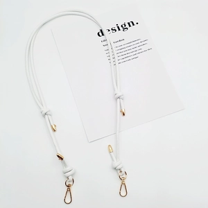 Adjustable white leather shoulder strap with gold metal buckles and knotted detail