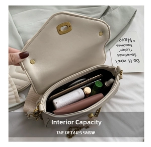 Interior view of beige quilted chain bag showing capacity for phone and cosmetics