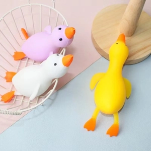 Three cute rubber duck squeeze toys in purple, white, and yellow for kids stress relief