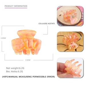 Mini acetate hair claw clip with orange marble pattern showing dimensions and material details