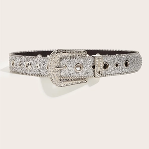 Close-up of a silver Y2K rhinestone belt featuring shiny glitter and metal eyelets