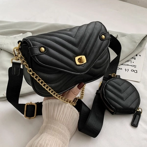 Black V-quilted shoulder bag with gold hardware, wide strap and mini coin purse