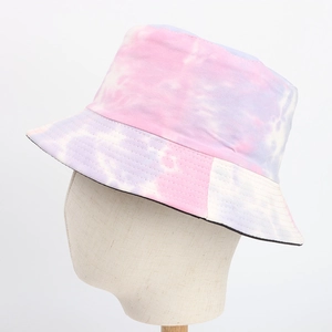Close-up view of a vibrant pink and purple tie-dye bucket hat for sun protection