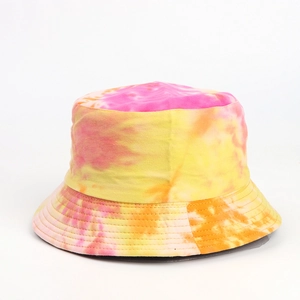 Detailed view of vibrant pink and yellow tie-dye patterns on a canvas bucket hat.