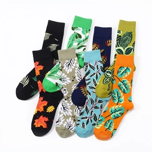 Mid-calf cotton socks featuring artistic leaf patterns in assorted vibrant colors