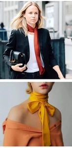 Detail showing red and yellow silk scarves styled as neck ties and ribbon bows