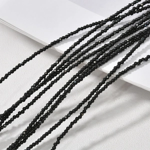 Detailed view of 2-2.5mm black mother of pearl mini round beads for DIY jewelry making