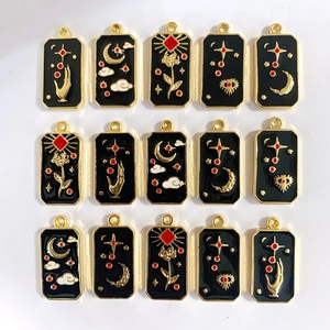 Black and gold celestial tarot pendants with moon and eye motifs for DIY jewelry making