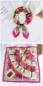 Close-up of pink and gold satin square scarf with vintage equestrian horse bit prints