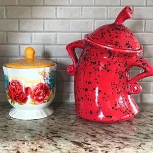 Canister with Attitude ceramic storage jars in floral and red spotted designs with lids