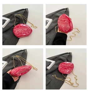 Pink marble acrylic clutch bag with gold chain strap shown from multiple angles