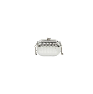 Close-up of silver acrylic evening clutch bag with vertical grooved texture and metal chain
